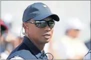  ?? [ASSOCIATED PRESS FILE] ?? In this Sept. 28, 2017, photo, Tiger Woods looks on before the first round of the Presidents Cup at Liberty National Golf Club in Jersey City, N.J.