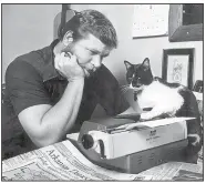  ??  ?? This rare 1984 photo shows Otus the Head Cat dictating his column to Owner. It was a weekly habit until Otus’ death in 1992. These days, he just emails it directly.