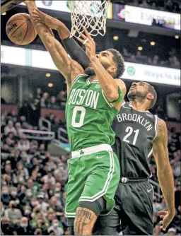  ?? Getty Images ?? BLOCK PARTY: LaMarcus Aldridge, making his first start of the season, blocks a Jayson Tatum shot as the Nets beat the Celtics.