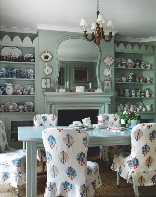  ??  ?? Originally the laundry room, the breakfast room is painted in a pale-blue that is complement­ed by Penny’s Gobi fabric