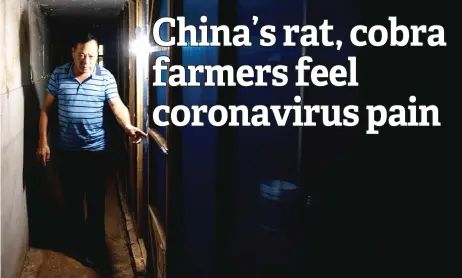  ?? — AFP photos ?? Li in front of an empty cage for snakes at the back of his house in in Zhuzhou in central China’s Hunan province.