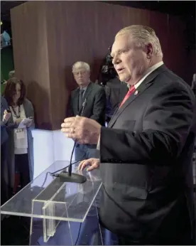  ?? The Canadian Press ?? PC Ontario Leadership candidate Doug Ford speaks with journalist­s at the TVO studios in Toronto on Thursday.