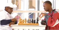  ??  ?? above Donald Harris, 66, left, a Duncanvill­e school district bus driver, plays chess with Duncanvill­e High School student Gerald Watson on Dec. 11, 2017, during lunch in the school’s cafeteria. Harris spends his lunch hour teaching the game of chess to...