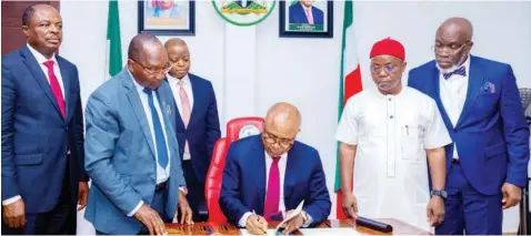  ?? ?? Chief of Staff to the Governor of Enugu State, Victor Udeh ( left); Clerk to the Enugu State House of Assembly, Dr. Emma Udaya; Special Adviser on Legal, Osinachi Nnajieze; Enugu State Governor, Dr. Peter Mbah; Speaker, Enugu State House of Assembly, Uchenna Ugwu; and the Secretary to the State Government, Prof. Chidiebere Onyia, during the signing of the Enugu State University of Medical and Applied Sciences Teaching Hospital Bill into law by the governor at the Government House, Enugu... yesterday