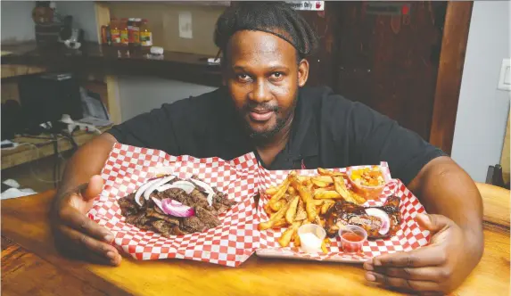  ?? TONY CALDWELL ?? At African Grill on Clyde Avenue, chef-owner Koele Khutlang cooks suya, the grilled meat of West Africa, and braai, the grilled meat of South Africa.