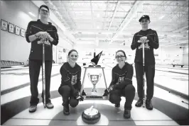  ?? @TMartin Herald Herald photo by Tijana Martin ?? Ben Townley, left, Kalli Hansen, Hannah Terry and Braden Austin from Chinook High School’s “Team Terry” are the High School Curling League Champions.