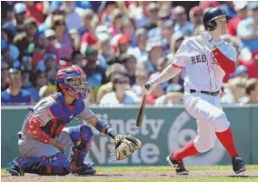  ?? STAFF PHOTO BY CHRISTOPHE­R EVANS ?? GETTING BACK AT IT: Brock Holt belts a two-run homer as Texas catcher Robinson Chirinos looks on during the third inning yesterday.