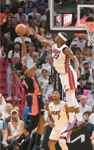  ?? AP ?? Miami’s Jimmy Butler blocks a shot attempt by New York during Game 4 of the Eastern Conference semifinals Monday night.