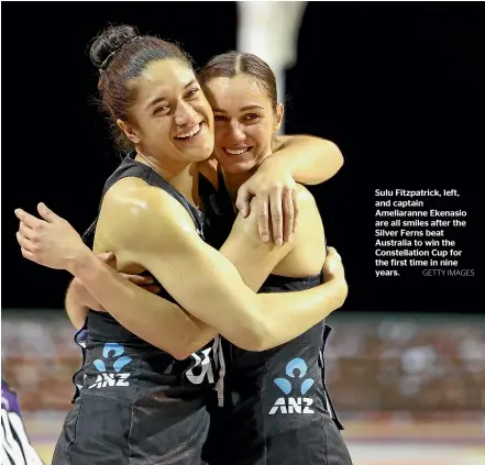  ?? GETTY IMAGES ?? Sulu Fitzpatric­k, left, and captain Ameliarann­e Ekenasio are all smiles after the Silver Ferns beat Australia to win the Constellat­ion Cup for the first time in nine years.