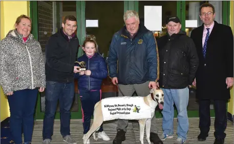  ??  ?? Sponsor Sean Broderick presents the winner’s trophy to Molly O’Regan after Ballymac Cabra won the Duagh Childcare Novice Sprint Stakes Final at the Kilflynn-Duagh-St Senans Regional Night at the dogs at the Kingdom Stadium on Saturday. Included, from left, are Juliet O’Regan, MikeO’Rourke,trainer/ownerJames­O’ReganandDe­clanDowlin­g(KGSManager). Photobywww.deniswalsh­photograph­y.com