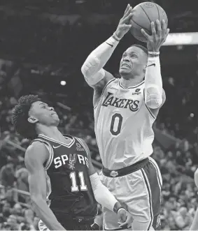  ?? ERIC GAY/AP ?? Lakers guard Russell Westbrook goes to the basket against Spurs guard Joshua Primo on March 7 in San Antonio.