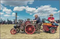  ??  ?? HITCHING A LIFT: Lawrence Vasey, of Pickering, and David Foster, of Helmsley, on a 4in Scale Burrell Road Loco.