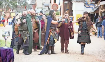  ??  ?? A group drinking beer in kilts and capes walks down a pathway at the Arizona Renaissanc­e Festival on Feb. 9, 2019, in Gold Canyon. ANYA MAGNUSON/THE REPUBLIC