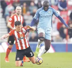  ??  ?? Sunderland’s Billy Jones in action with Manchester City’s Yaya Toure (right) during the English Premier League match at Stadium of Light in this March 5, 2017 file photo. — Reuters photo