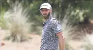  ?? John Raoux / Associated Press ?? Dustin Johnson reacts after missing a birdie putt on the eighth green during the first round of The Players Championsh­ip on Thursday.