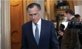  ?? Photograph: J Scott Applewhite/AP ?? Mitt Romney leaves the Senate chamber.