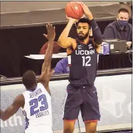  ?? Steven Branscombe / USA Today ?? UConn’s Tyler Polley ( 12) shoots over Creighton’s Damien Jefferson in the first half on Saturday.