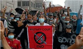  ?? AP ?? Anti-coup protesters flash their three-finger salute during a demonstrat­ion in Yangon yesterday. The United Nations envoy for Myanmar says the military is facing ‘‘unexpected difficulti­es’’ in consolidat­ing power after overthrowi­ng the country’s elected government in February.