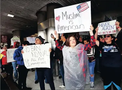  ?? PICTURE: AP ?? Demonstrat­ors rally against US President Donald Trump’s refugee ban at Miami Internatio­nal Airport on Sunday.