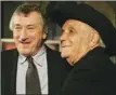  ?? The Associated Press ?? Robert De Niro, left, and boxer Jake LaMotta attended the 25th anniversar­y screening of the movie Raging Bull in New York in 2005.