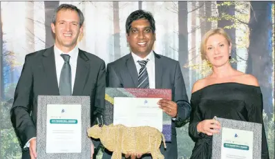  ??  ?? Mahesh Cooper (centre), a director of Allan Gray, with the Raging Bull for the South African Management Company of the Year; Nic Andrew (left), the head of Nedgroup Investment­s, who collected the certificat­e for the third-best domestic management...