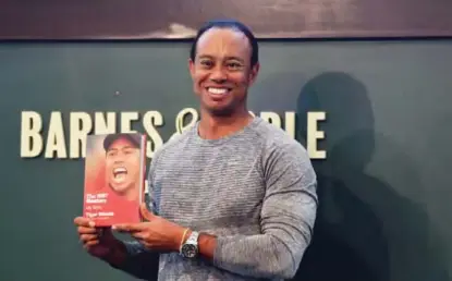  ??  ?? NEW YORK: This file photo taken on March 20, 2017 shows 14-time major champ golfer Tiger Woods holdig a copy of his new book “The 1997 Masters: My Story” before his book signing at Barnes & Noble’s Union Square in New York. Golf superstar Tiger Woods...