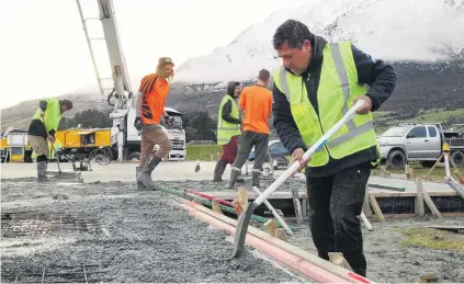  ?? PHOTO: GUY WILLIAMS ?? First pad down . . . Queenstown Concrete Floors owner Mana Skipper works on the first home foundation to be laid at the Hanley’s Farm subdivisio­n near Queenstown yesterday.