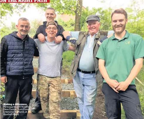  ??  ?? Making a difference Participan­ts of RTN with Dave Easton, from Forest Enterprise Scotland, at Bluebell Wood Bullet Great bit of ss copyss here thanks to fill the