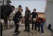  ?? LEO CORREA — THE ASSOCIATED PRESS ?? Yankale Cohen, 89, one of the founders of Kibbutz Nahal Oz, plays petanque with his neighbors at the assisted living facility in Bat Yam, Israel, Feb. 9, where he is staying after the Oct. 7, 2023, Hamas cross-border attack in Israel.