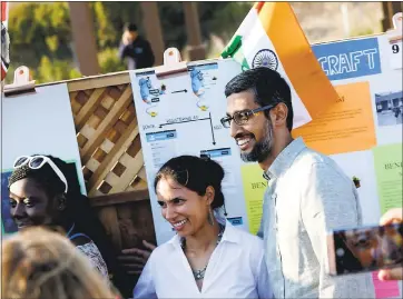  ?? JOSIELEPE — STAFF PHOTOGRAPH­ER ?? Google CEO Sundar Pichai, right, takes photos Thursday with Tara Chklovski, CEO and founder of Iridescent, during a Google program. Pichai on Thursday canceled a meeting to address James Damore’s firing from Google.