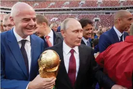  ?? Photograph: Oleg Nikishin - FIFA/FIFA via Getty Images ?? ‘There can be no normal sporting relations with an abnormal regime like that of Vladimir Putin.’ Fifa President Gianni Infantino and Putin in Moscow during the 2017 World Cup trophy tour.