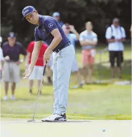  ?? aP PHOTO ?? ON A ROLL: Rickie Fowler couldn’t hole this birdie putt on No. 3 during yesterday’s first round of the PGA Championsh­ip, but four birdies on the back nine put him in a tie for ninth after 18 holes.