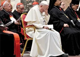  ?? AP/VINCENZO PINTO ?? Pope Francis bows his head Saturday during a penitentia­l liturgy at the Vatican, part of a gathering that included frank testimony about church leaders’ silence on clergy sexual abuse.