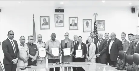  ?? ?? MoU signed: Home Affairs Minister Robeson is fifth from left, US Ambassador Nicole Theriot is sixth from left. (Ministry of Home Affairs photo)