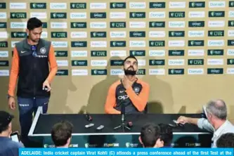  ??  ?? ADELAIDE: India cricket captain Virat Kohli (C) attends a press conference ahead of the first Test at the Adelaide Oval in Adelaide yesterday. — AFP