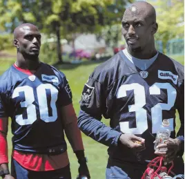  ?? STAFF PHOTO BY NANCY LANE ?? DEFENSIVE POSITION: Devin McCourty, shown with twin brother Jason (30) yesterday in Foxboro, criticized the NFL’s decision last week to not include player input on the new anthem policy.