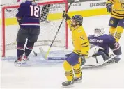  ?? Brian A. Pounds / Hearst Connecticu­t Media ?? Quinnipiac’s Ethan DeJong celebrates his first period goal against UConn in the final of the Connecticu­t Ice tournament on Saturday.