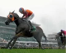  ?? GETTY IMAGES ?? Opie Bosson rides Melody Belle to victory in the Empire Rose Stakes at Flemington last November.