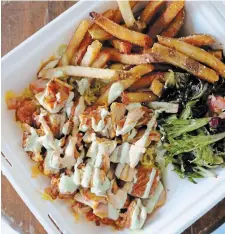  ?? J OYC E L E U N G ?? Plate of perfection: Charcoal grilled chicken with home made yogurt sauce, hand cut fries and salad.