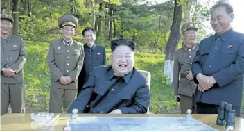  ?? KOREAN CENTRAL NEWS AGENCY/KOREA NEWS SERVICE VIA THE ASSOCIATED PRESS ?? In this undated photo distribute­d by the North Korean government Monday, North Korean leader Kim Jong Un watches the test launch of a solid-fuel Pukguksong-2 at an undisclose­d location in North Korea.