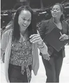  ?? WADE PAYNE, AP ?? South Carolina head coach Dawn Staley, left, leaves the court with longtime assistant coach Nikki McCray after a 2012 victory.
