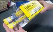  ?? Rich Pedroncell­i Associated Press ?? A PACKAGE of EpiPen epinephrin­e auto-injectors. Mylan bought the rights to sell them in 2007.