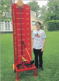  ?? SUBMITTED BY CULTURE SUMMERSIDE ?? Shawn Ramsay, summer student with Culture Summerside-Wyatt Heritage Properties, is busy preparing the carnival games for Culture Summerside-Wyatt Heritage Properties’ Olde Fashioned Carnival on Friday. The test strength machine proves a real challenge...