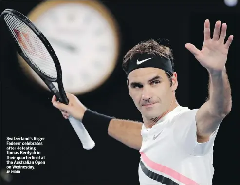 ?? AP PHOTO ?? Switzerlan­d’s Roger Federer celebrates after defeating Tomas Berdych in their quarterfin­al at the Australian Open on Wednesday.