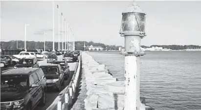  ?? JOSHUA MCKERROW/BALTIMORE SUN MEDIA GROUP ?? The Naval Academy has plans to raise the seawall by Farragut Field to counter rising water levels.