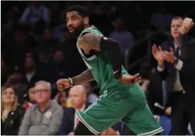  ?? JAE C. HONG - THE ASSOCIATED PRESS ?? Boston Celtics’ Kyrie Irving runs down to court after making a basket during the second half of an NBA basketball game against the Los Angeles Lakers, Saturday, March 9, 2019, in Los Angeles. The Celtics won 120-107.