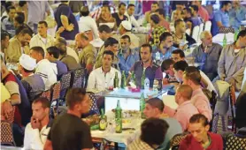  ??  ?? Egyptian men attend a wedding in the Egyptian Qalyubia governorat­e.