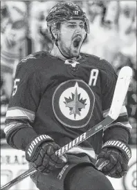  ?? CP PHOTO ?? Winnipeg Jets’ Mark Scheifele celebrates his goal against the Minnesota Wild during second period of NHL playoff game Wednesday in Winnipeg.