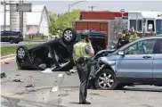  ?? BILL LACKEY/STAFF ?? A 17-year-old was killed and another person was transporte­d by Careflight after a two-car accident on Urbana Road north of Ohio Rt. 334 Thursday.