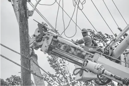  ?? DANIEL BROWN/THE GUARDIAN ?? Maritime Electric crews worked overnight Saturday and most of Sunday restoring power to Islanders after Dorian swept through the region. According to an EMO news release, 75 per cent of P.E.I. was without power during the height of the storm.